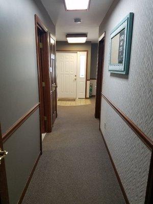 Hallway to therapy rooms and rest room