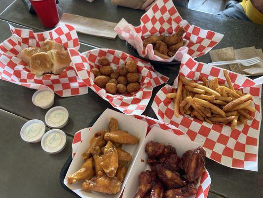 Wings, fries, mushrooms and rolls