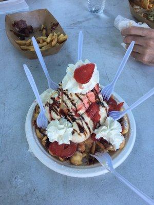 Funnel cake with ice cream, whipped cream and so much more!