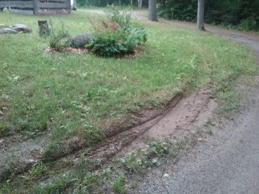 First he drove across the lawn, then clipped this whole edge with his huge duel tires and very heavy truck.