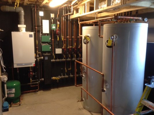 Viessmann Vitodens 200 high efficiency boiler with 2 119 gallon storage tanks to support shower body spray system.