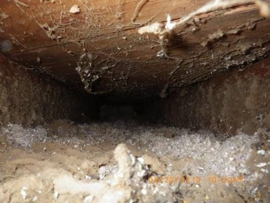 Panned duct using floor joist. Before cleaning.