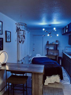 Color changeable lights by request: View of massage therapy treatment in low light & evening hours