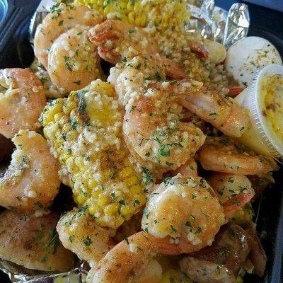 Shrimp platter with extra shrimp with a seafood boil side