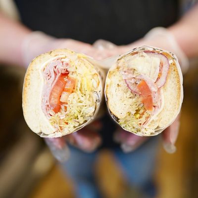 Ham and Cheese with lettuce, tomatoes, onions, oil and vinegar with spices.