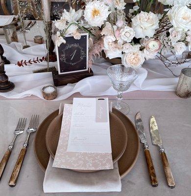 Table number - Lasered leather backed by a pvc with bronze rivets standing in a stained wood base