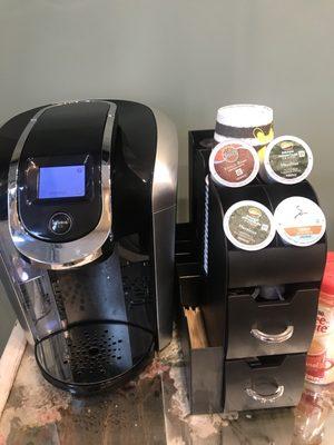 Waiting area has plenty of coffee and tea.