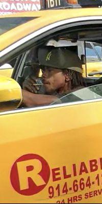 Reliable Taxi employee caught smoking weed while driving.