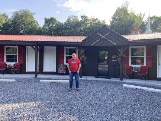 Nice roof, nice red shutters, nice rocks-- CLEAN and WELL CARED FOR.