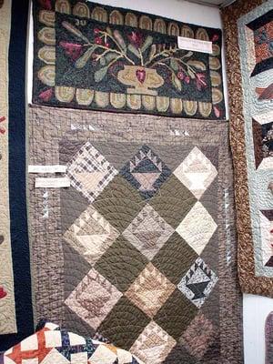 Primitive basket quilt and a hooked wool table runner (top).