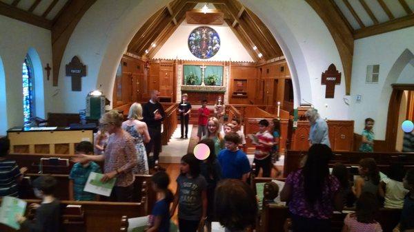 Students sing as they file in for chapel and spiritual learning