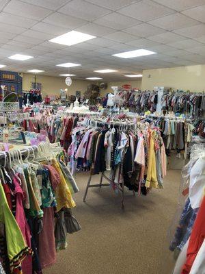 a few of the many racks of children's clothing