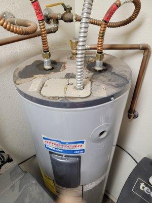 Before: Old water heater (12 years old) was leaking and needed to be replaced.