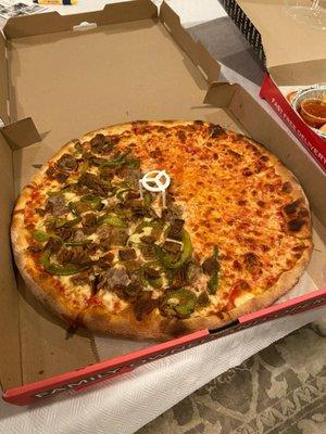 Large pie.Half pepper, eggplant and sausage, half plain