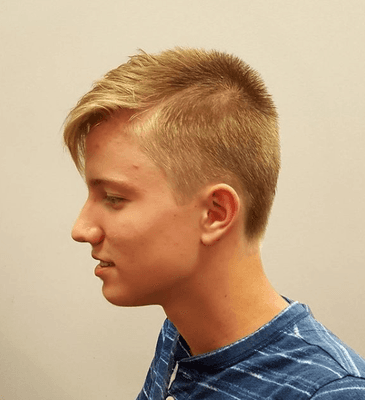 Great summer haircut for a life guard.he has the awesome bangs