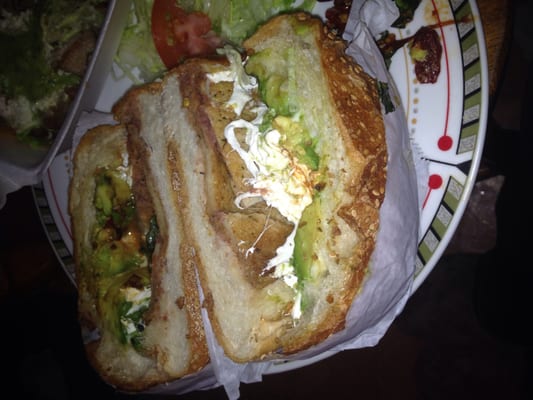 Cemita. Chicken, cheese, avocado, and green peppers. Adding the green spice sauce makes it taste amazing.