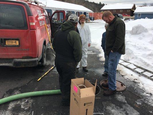 I.B.S. Septic & Drain, Inc. inspecting the septic system.