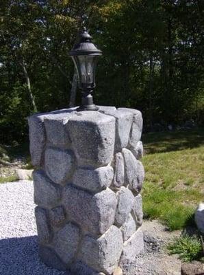 Textured and carved concrete light post.