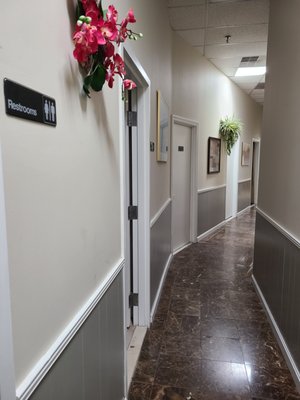 Restroom doors at the back of the salon.