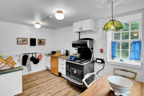 1910's era kitchen furnished with everything you need to make a delicious meal