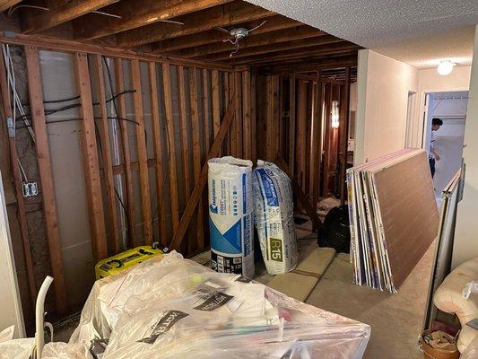 Dining area and bathroom under construction.