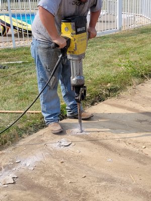 Concrete pad demo under shed