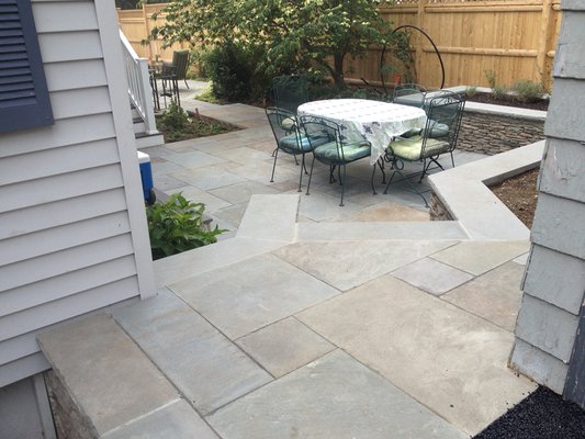 Stonewall and bluestone patio.