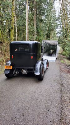 Model A Sedan getting ready to load onto transport.