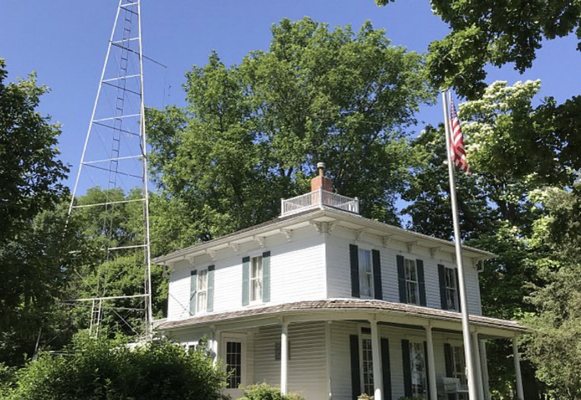 The Ensor's homestead with radio tower