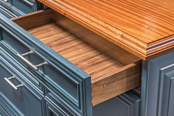 Grothouse Custom Sapele Countertop and Canyon Creek Cabinetry and Walnut drawer box