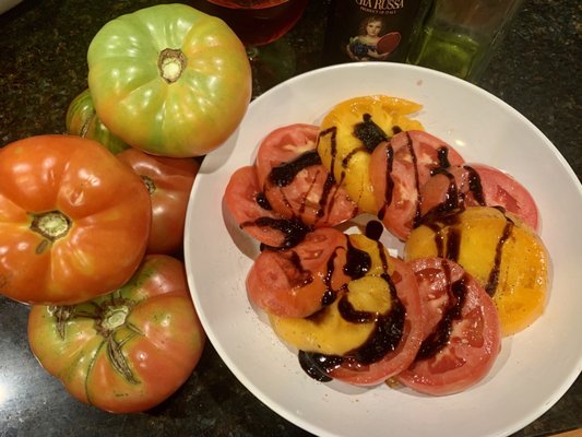 Tomatoes drizzled with olive oil and glazed balsamic vinaigrette. Super simple but oh so delicious.