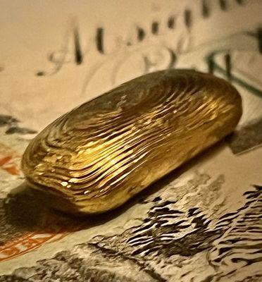 nearly perfect ripples in this hand poured gold ingot .999 made by urs truly PM