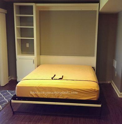 White queen size panel Murphy bed with bed opened.