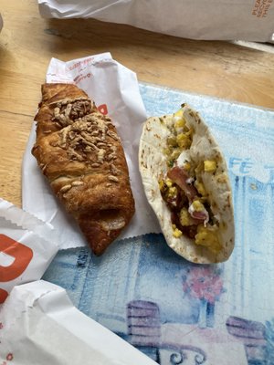 Ham and cheese croissant and breakfast taco.