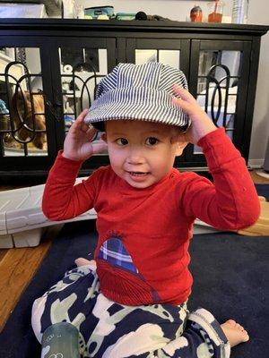 My son in his train conductor hat