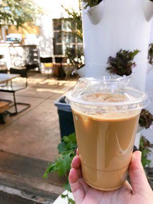 Iced vanilla latte with oat milk