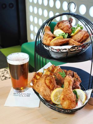 Stadium Club's chef-driven menu features elevated sports bar fare including award-winning fried chicken & waffles