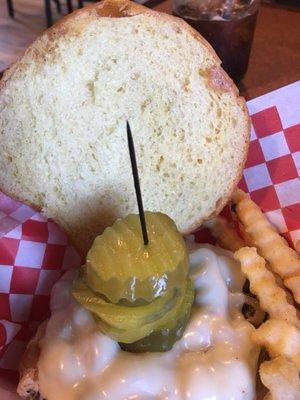 Tower of pickles top the burger