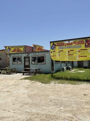 Outside; located inside a tire shop property.