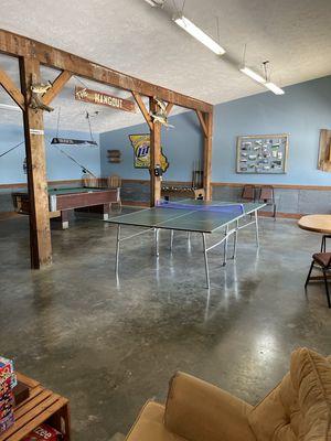 Enjoy an out Hangout Room that is comprised with a TV, bar, pool tables and more...