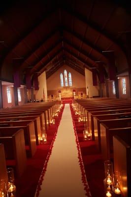 Candlelit/rose petal church aisle