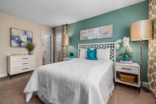 main bedroom with carpeting and large picture window