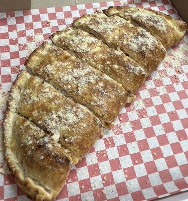 Calzone served marinara and garlic butter