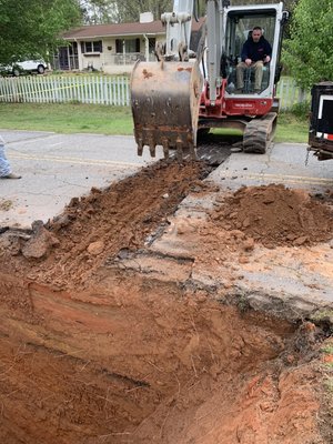 Cutting road for sewer line