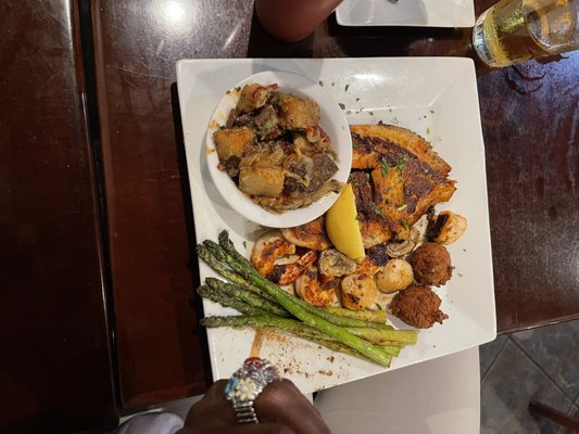 Catfish shrimp and asparagus, with hush puppy's.