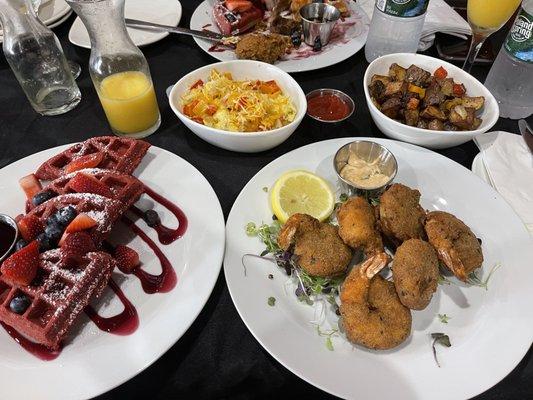 Red Velvet waffles, Deep fried shrimp,loaded scrambled eggs, and home fries.