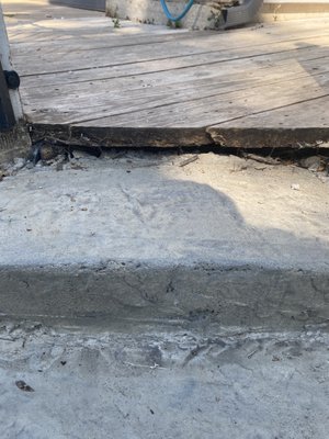 Step that isn't even level. His fix was to put a stone on top. The crew told us they could remove and re-pour  and Cody would not agree