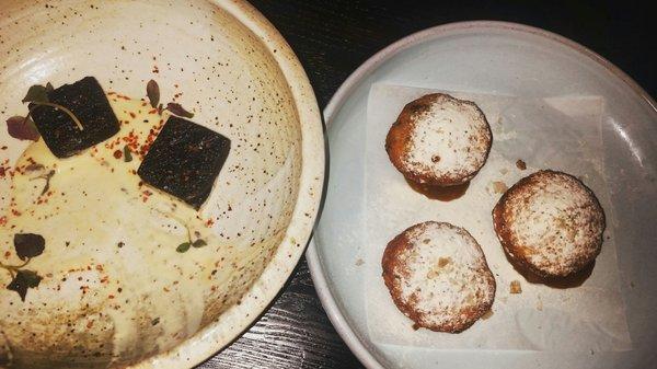 Black garlic chickpea fritter on the left and Sauerkraut fry bread with applesauce on the right.