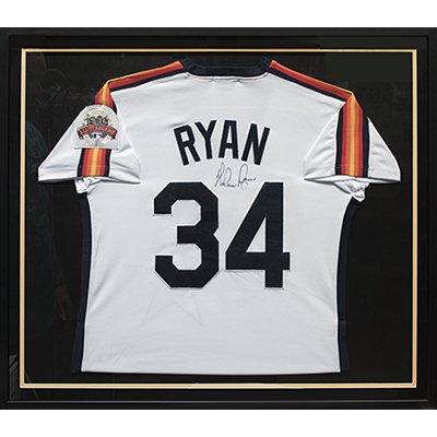 Example of framed jersey with double mat that is floated and black wood frame.