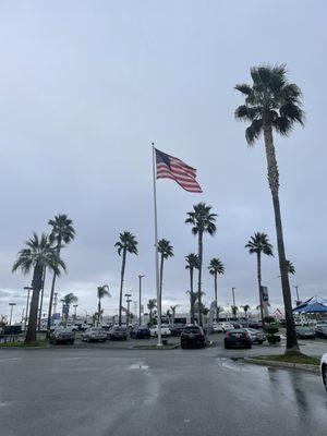 Giant parking lot, beautiful flag pole display.